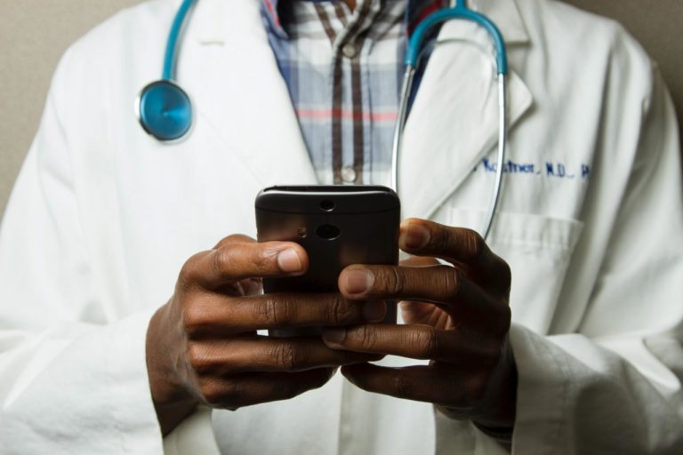 Doctor who treats Crohn’s disease, using his phone